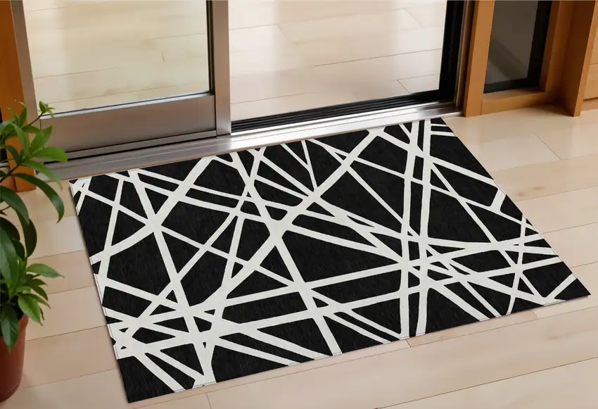 Black And Ivory Geometric Washable Indoor Outdoor Area Rug Photo 1