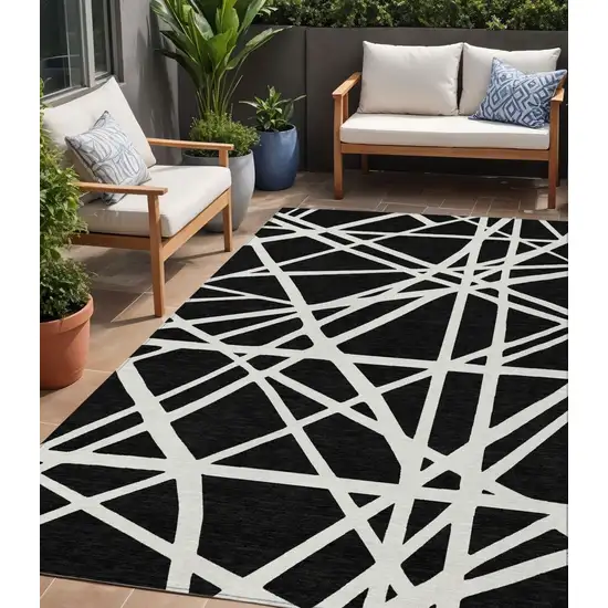 Black And Ivory Geometric Washable Indoor Outdoor Area Rug Photo 1