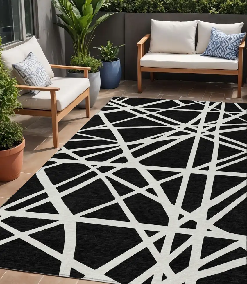 Black And Ivory Geometric Washable Indoor Outdoor Area Rug Photo 1