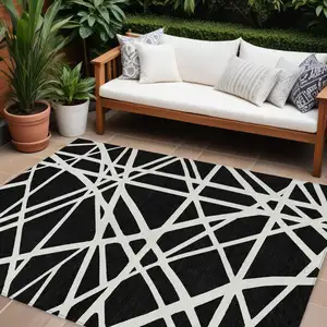 Photo of Black And Ivory Geometric Washable Indoor Outdoor Area Rug