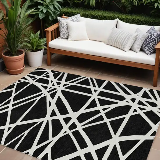 Black And Ivory Geometric Washable Indoor Outdoor Area Rug Photo 1