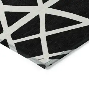 Photo of Black And Ivory Geometric Washable Indoor Outdoor Area Rug