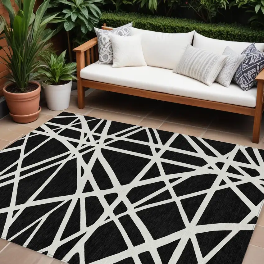 Black And Ivory Geometric Washable Indoor Outdoor Area Rug Photo 1