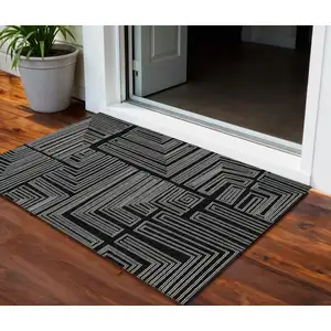Photo of Black And Ivory Geometric Washable Indoor Outdoor Area Rug