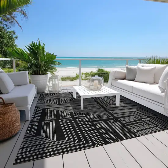 Black And Ivory Geometric Washable Indoor Outdoor Area Rug Photo 9