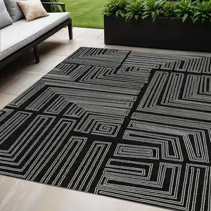 Photo of Black And Ivory Geometric Washable Indoor Outdoor Area Rug
