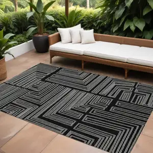 Photo of Black And Ivory Geometric Washable Indoor Outdoor Area Rug