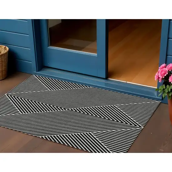 Black And Ivory Geometric Washable Indoor Outdoor Area Rug Photo 1