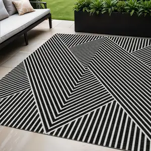 Photo of Black And Ivory Geometric Washable Indoor Outdoor Area Rug