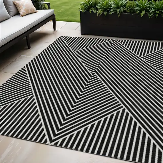Black And Ivory Geometric Washable Indoor Outdoor Area Rug Photo 1