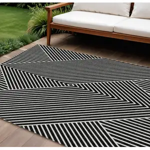 Photo of Black And Ivory Geometric Washable Indoor Outdoor Area Rug