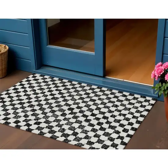 Black And Ivory Geometric Washable Indoor Outdoor Area Rug Photo 2