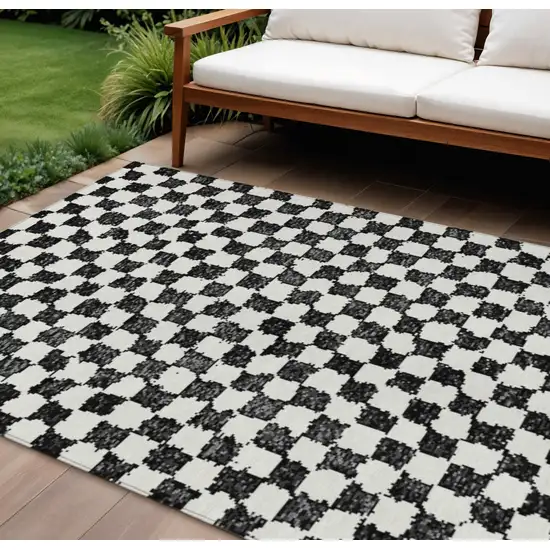 Black And Ivory Geometric Washable Indoor Outdoor Area Rug Photo 2