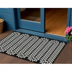Photo of Black And Ivory Geometric Washable Indoor Outdoor Area Rug