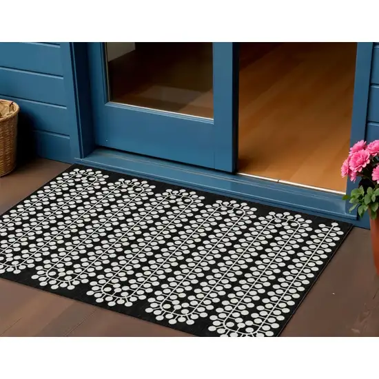 Black And Ivory Geometric Washable Indoor Outdoor Area Rug Photo 1