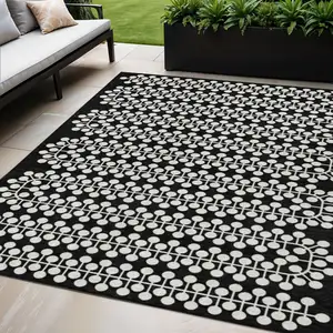 Photo of Black And Ivory Geometric Washable Indoor Outdoor Area Rug