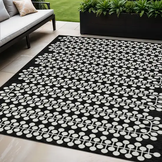Black And Ivory Geometric Washable Indoor Outdoor Area Rug Photo 1