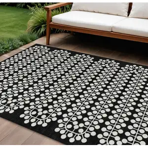 Photo of Black And Ivory Geometric Washable Indoor Outdoor Area Rug