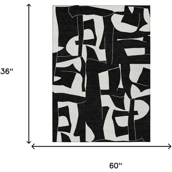 Black And Ivory Geometric Washable Indoor Outdoor Area Rug Photo 6