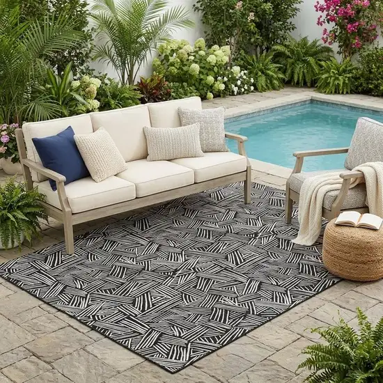 Black And Ivory Geometric Washable Indoor Outdoor Area Rug Photo 1