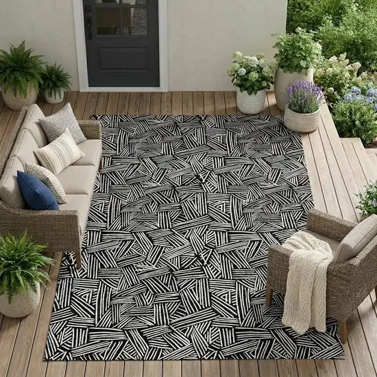 Black And Ivory Geometric Washable Indoor Outdoor Area Rug Photo 1