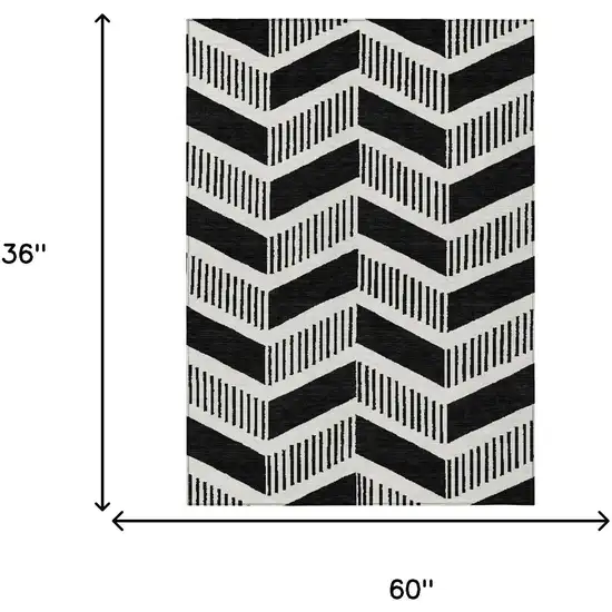 Black And Ivory Geometric Washable Indoor Outdoor Area Rug Photo 6