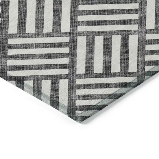 Black And Ivory Geometric Washable Indoor Outdoor Area Rug Photo 4