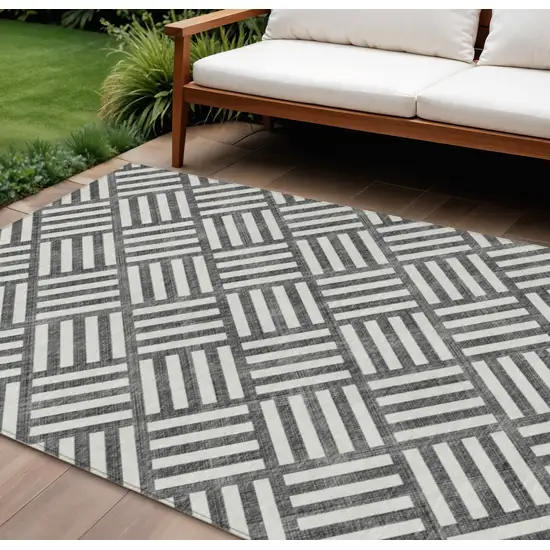 Black And Ivory Geometric Washable Indoor Outdoor Area Rug Photo 1