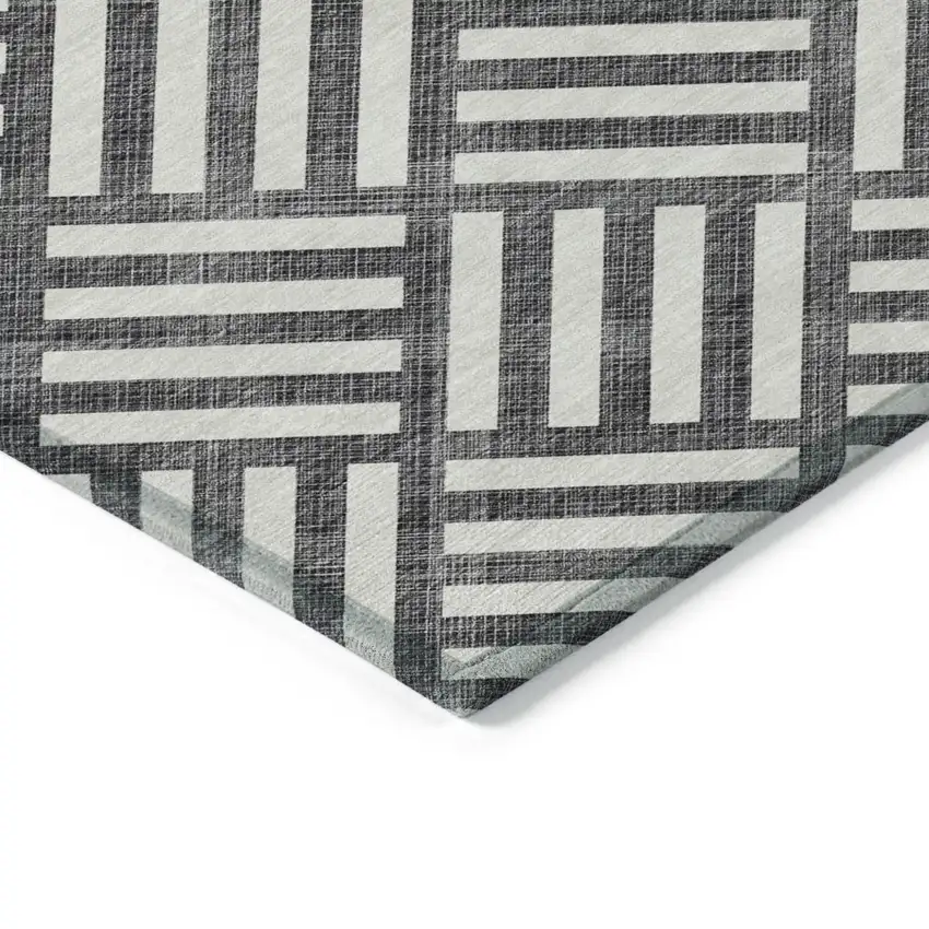 Black And Ivory Geometric Washable Indoor Outdoor Area Rug Photo 4