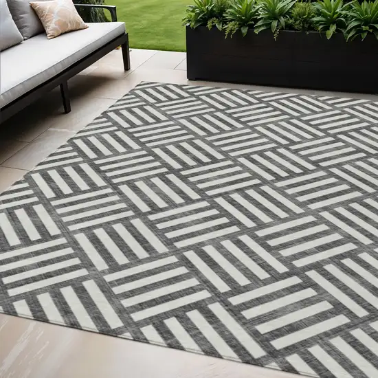 Black And Ivory Geometric Washable Indoor Outdoor Area Rug Photo 1