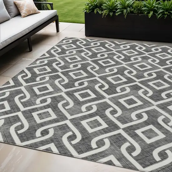 Black And Ivory Geometric Washable Indoor Outdoor Area Rug Photo 1