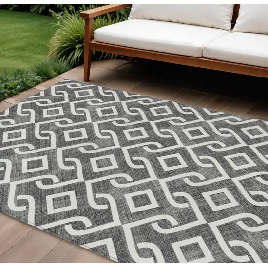 Black And Ivory Geometric Washable Indoor Outdoor Area Rug Photo 1