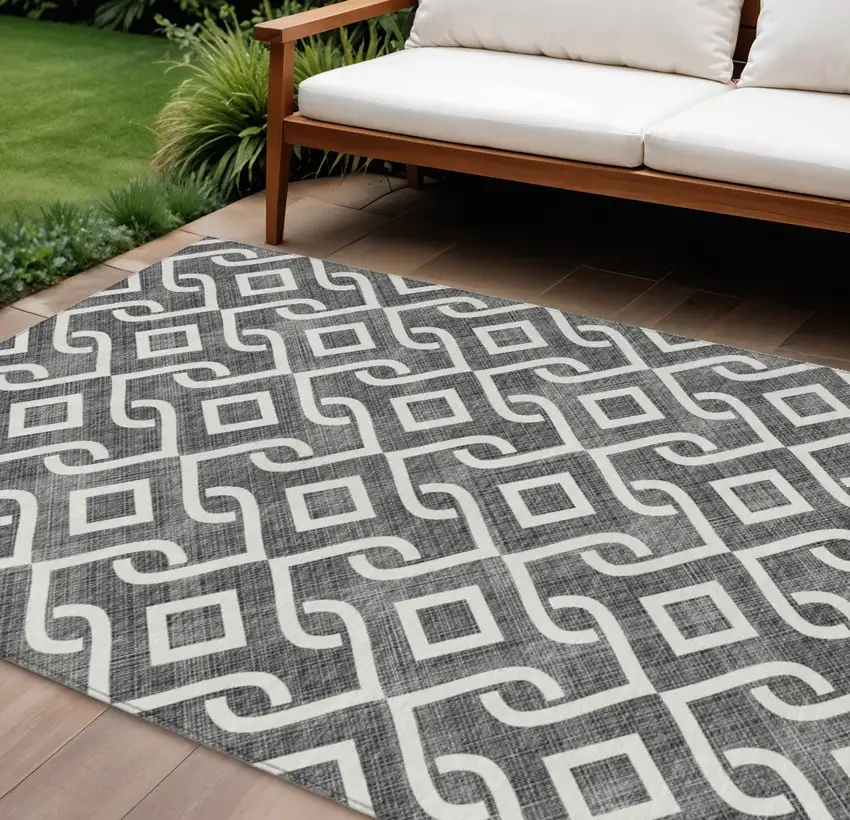 Black And Ivory Geometric Washable Indoor Outdoor Area Rug Photo 1