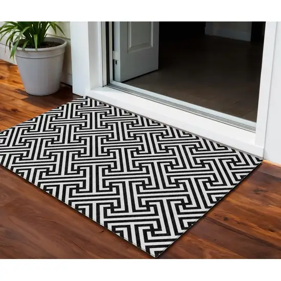 Black And Ivory Geometric Washable Indoor Outdoor Area Rug Photo 1