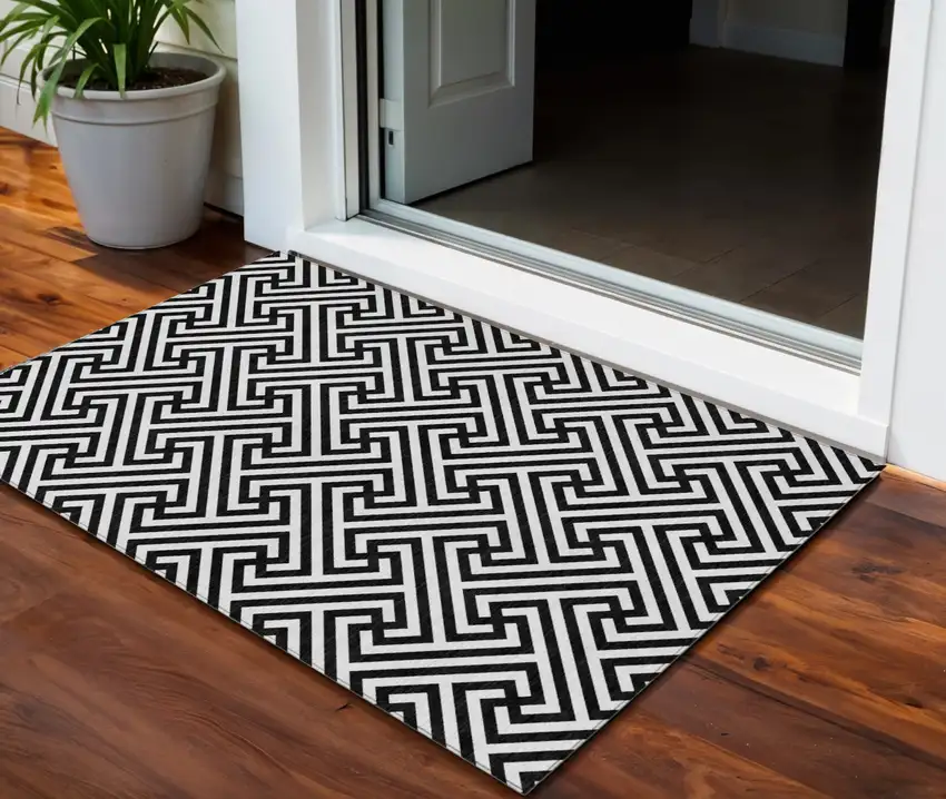 Black And Ivory Geometric Washable Indoor Outdoor Area Rug Photo 1
