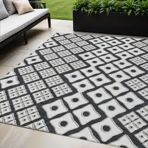 Photo of Black And Ivory Geometric Washable Indoor Outdoor Area Rug