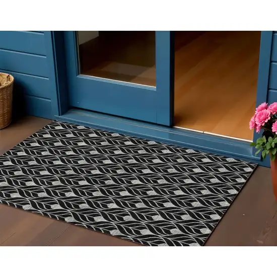 Black And Ivory Geometric Washable Indoor Outdoor Area Rug Photo 1