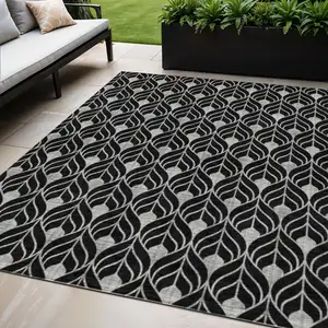 Photo of Black And Ivory Geometric Washable Indoor Outdoor Area Rug