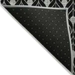 Photo of Black And Ivory Geometric Washable Indoor Outdoor Area Rug