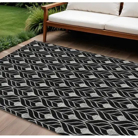 Black And Ivory Geometric Washable Indoor Outdoor Area Rug Photo 1