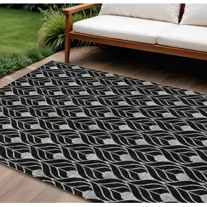 Photo of Black And Ivory Geometric Washable Indoor Outdoor Area Rug