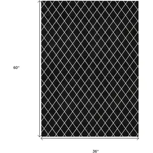 Photo of Black And Ivory Geometric Washable Indoor Outdoor Area Rug