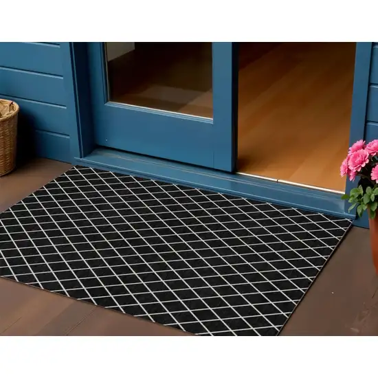 Black And Ivory Geometric Washable Indoor Outdoor Area Rug Photo 1