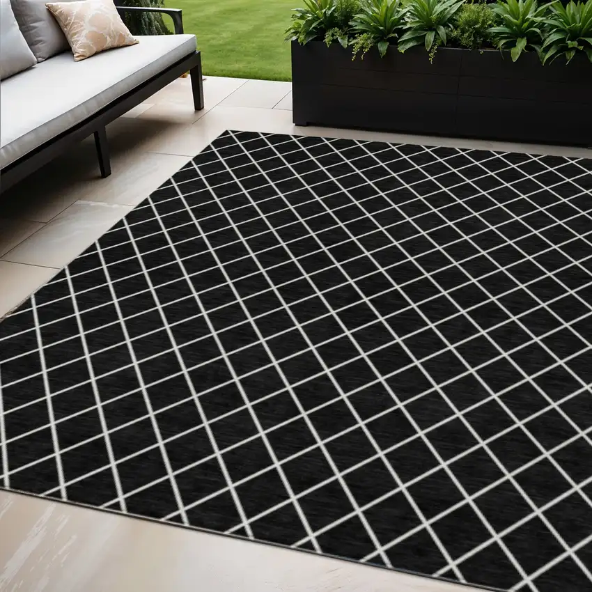 Black And Ivory Geometric Washable Indoor Outdoor Area Rug Photo 1