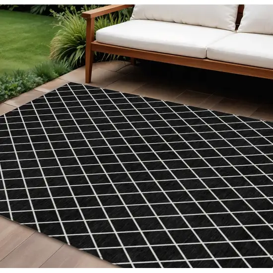 Black And Ivory Geometric Washable Indoor Outdoor Area Rug Photo 1