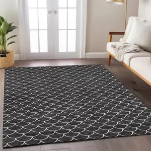 Photo of Black And Ivory Geometric Washable Indoor Outdoor Area Rug