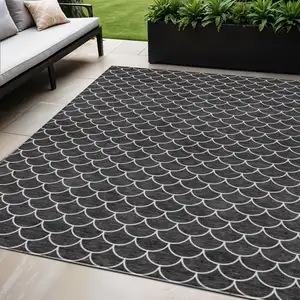 Photo of Black And Ivory Geometric Washable Indoor Outdoor Area Rug