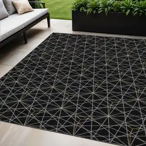 Photo of Black And Ivory Geometric Washable Indoor Outdoor Area Rug