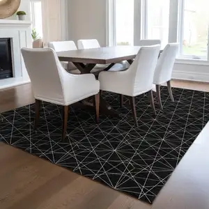 Photo of Black And Ivory Geometric Washable Indoor Outdoor Area Rug