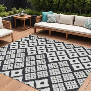 Photo of Black And Ivory Geometric Washable Indoor Outdoor Area Rug